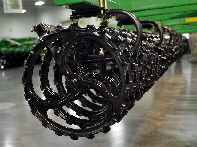 Instead of a basket at the end of its new primary tillage tool, the Short Disk, Great Plains uses cast iron rollers of its own design. Rollers on tillage tools are more common in Europe than in North America. (DTN/The Progressive Farmer photo by Jim Patrico)