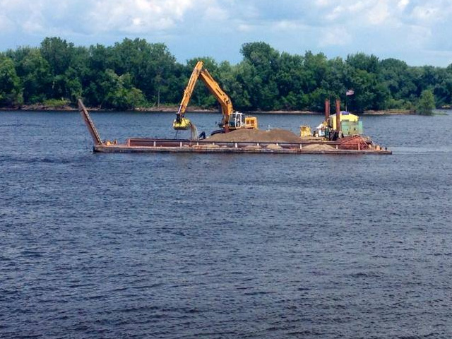 When shoaling occurs, the Army Corps of Engineers needs to dredge the area, closing all traffic on either side of the area. (Photo courtesy of USACE St. Paul District)