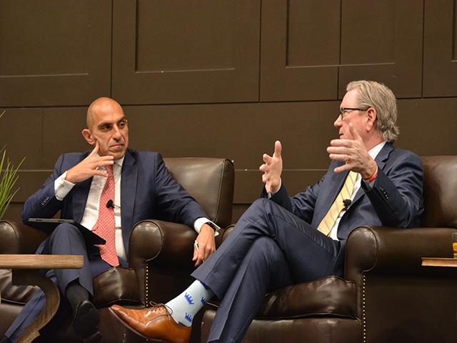 Rostin Behnam, left, chairman of the Commodity Futures Trading Commission (CFTC), listens to Jeffrey Schmid, chairman of the Kansas City Federal Reserve Bank, talk about the agricultural economy and the Fed&#039;s task to lower inflation to 2%. Schmid explained the reluctance of Fed bankers right now to lower interest rates. (DTN photo by Chris Clayton)