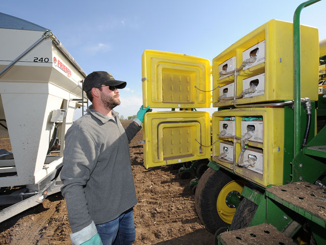 A grower near Clear Lake, Iowa, checks his insecticide system before planting. More and more growers are adding planting-time soil insecticides back into their rootworm management system, as resistance to Bt-traits spreads. (DTN photo by Bob Elbert)