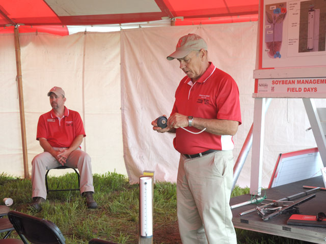 Gary Zoubek, University of Nebraska-Lincoln Extension educator for York County, explains an ET gauge to those attending a meeting at the UNL Soybean Management Field Days held at four locations across the state Aug. 12-15. This field day was located near Snyder in northeastern Nebraska on Friday Aug. 15. (DTN photo by Russ Quinn)