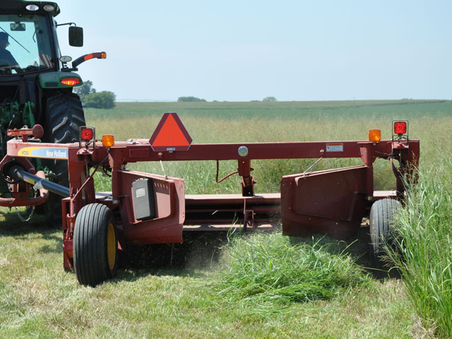 A test plot of switchgrass is harvested near Beaver Crossing, Neb., Tuesday as part of a University of Nebraska Extension biomass field day. A commercial switchgrass variety developed to survive cold Nebraska winters is set for release in spring 2016. (DTN photo by Todd Neeley)