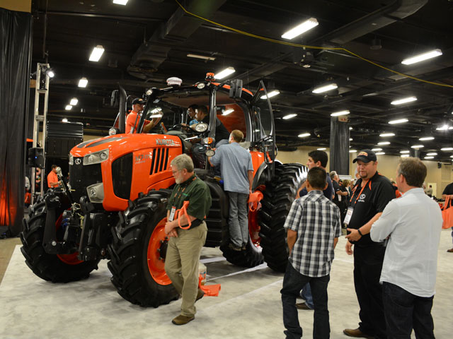 Kubota dealers check out a new M7 tractor. At 128- to 168-hp, the M7 line has application both for row-crop and livestock farmers as well as hay producers. (DTN/The Progressive Farmer photo by Virginia H. Harris)