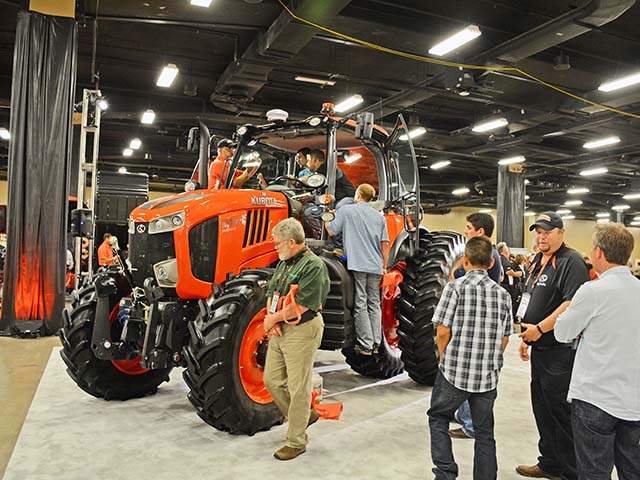 Kubota dealers check out a new M7 tractor. At 128 to 168 hp, the M7 line has application for row-crop growers and livestock farmers, as well as hay producers.
