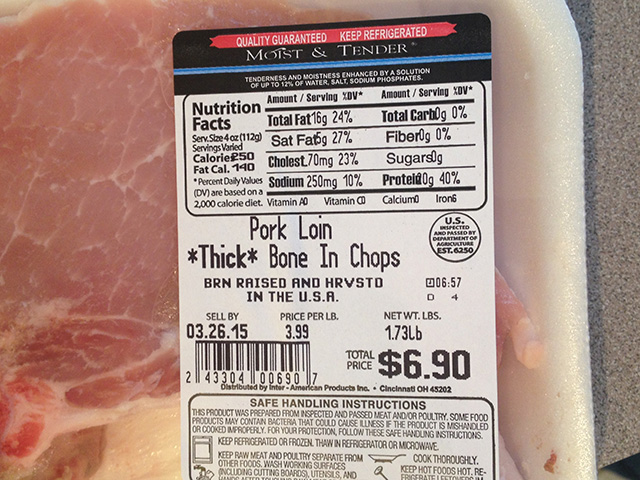 A label on pork chops declares the hog was born, raised and slaughtered in the U.S. Farm Bureau is repealing its backing of such country-of-origin labels since WTO has ruled against them. (DTN file photo by Katie Micik)