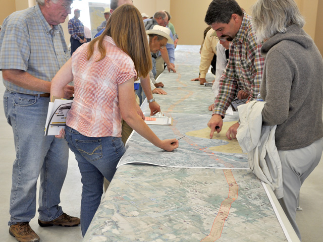 Nebraska landowners view a map of the proposed Keystone XL pipeline in an informational meeting held in 2012. (DTN photo by Todd Neeley)